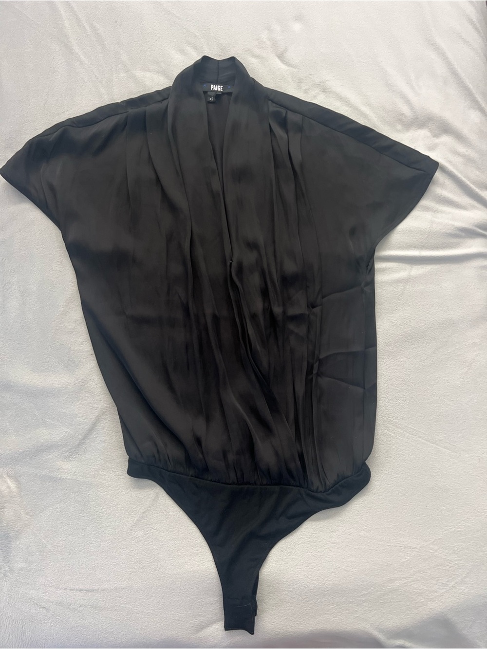 PAIGE Satin Short-Sleeve Faux-Wrap Thong Bodysuit in Black
